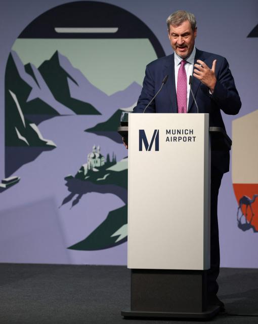 Bavaria's State Premier Markus Soeder addresses a press conference on the official opening of the new Terminal 1 pier at Munich International Airport, southern Germany on April 13, 2026. The Terminal 1 Pier provides additional capacity for up to six million passengers per year. The new building is currently one of Bavaria’s largest infrastructure projects. (Photo by Alexandra BEIER / AFP)