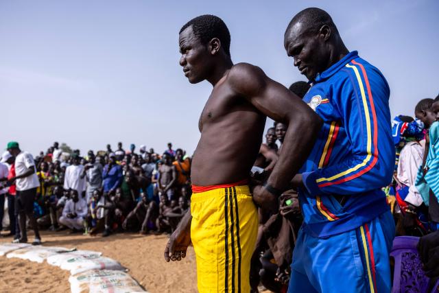 A Chadian wrestler from the Massa people prepares to wrestle at the Tokna Massana festival in Bongor on April 9, 2026. The culture of the Massa people was celebrated at the 10th edition of the Tokna Massana festival.
This year's celebration took on a special significance following the inscription last December of Guruna, a Massa pastoral initiation ritual, on UNESCO's list of intangible cultural heritage. (Photo by Joris Bolomey / AFP)