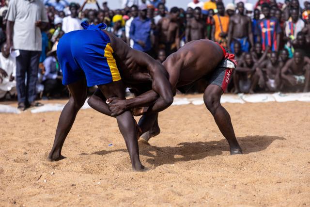 Two Chadian wrestlers from the Massa people compete at the Tokna Massana festival in Bongor on April 9, 2026. The culture of the Massa people was celebrated at the 10th edition of the Tokna Massana festival.
This year's celebration took on a special significance following the inscription last December of Guruna, a Massa pastoral initiation ritual, on UNESCO's list of intangible cultural heritage. (Photo by Joris Bolomey / AFP)
