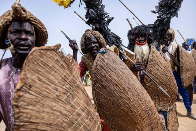 Massa people dressed as fighters arrive at the opening ceremony of the Tokna Massana Festival in Bongor on April 10, 2026. The culture of the Massa people was celebrated at the 10th edition of the Tokna Massana festival.
This year's celebration took on a special significance following the inscription last December of Guruna, a Massa pastoral initiation ritual, on UNESCO's list of intangible cultural heritage. (Photo by Joris Bolomey / AFP)