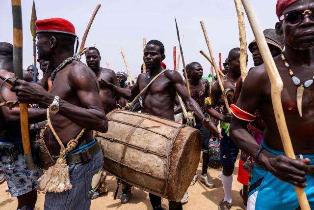 TOPSHOT - A Cameroonian musician with Massa dancers is plays the drums during the Tokna Massana Festival in Bongor on April 10, 2026. The culture of the Massa people was celebrated at the 10th edition of the Tokna Massana festival.
This year's celebration took on a special significance following the inscription last December of Guruna, a Massa pastoral initiation ritual, on UNESCO's list of intangible cultural heritage. (Photo by Joris Bolomey / AFP)
