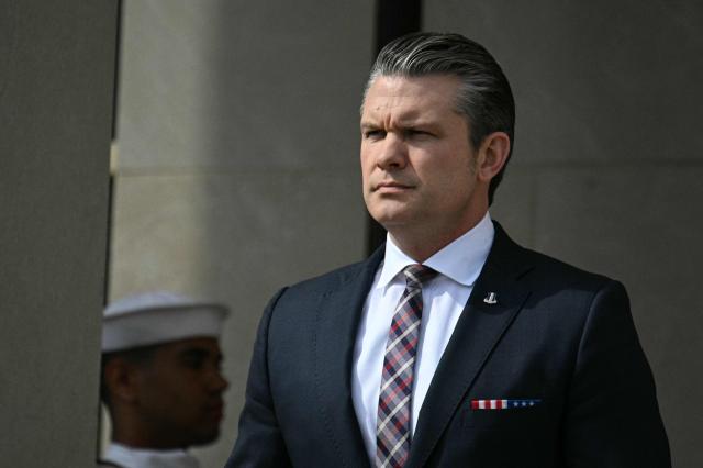 US Defense Secretary Pete Hegseth listens as national anthems are played during an honor cordon welcoming ceremony for Indonesian Defense Minister Sjafrie Sjamsoeddin at the Pentagon in Washington, DC, on April 13, 2026. (Photo by Jim WATSON / AFP)