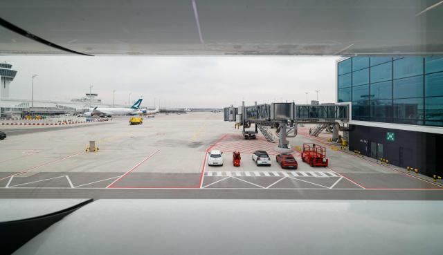 This general overview taken on April 13, 2026 shows an outside view of the new Terminal 1 pier at the Munich International Airport in Munich, southern Germany. The Terminal 1 Pier provides additional capacity for up to six million passengers per year. The new building is currently one of Bavaria’s largest infrastructure projects. (Photo by ALEXANDRA BEIER / AFP)