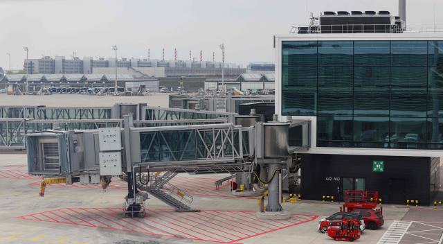 This general overview taken on April 13, 2026 shows an outside view of the new Terminal 1 pier at the Munich International Airport in Munich, southern Germany. The Terminal 1 Pier provides additional capacity for up to six million passengers per year. The new building is currently one of Bavaria’s largest infrastructure projects. (Photo by ALEXANDRA BEIER / AFP)