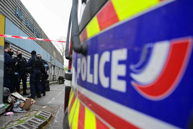 Police officers secure a perimeter around the scene where a 13-year-old teenager was shot dead in the Belles Roches neighbourhood in Villefranche-sur-Saône, north of Lyon in southern central France, on April 13, 2026. Two minors aged 15 and 12 were taken into custody after the fatal shooting of a 13-year-old early afternoon in Villefranche-sur-Saône, prosecutors said, adding that an investigation for "murder" has been opened. (Photo by Olivier CHASSIGNOLE / AFP)