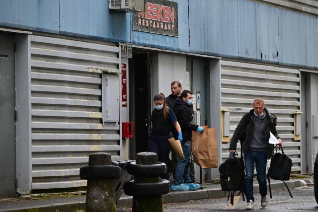 Forensic police carry evidence bags at the scene where a 13-year-old teenager was shot dead in the Belles Roches neighbourhood in Villefranche-sur-Saône, north of Lyon in southern central France, on April 13, 2026. Two minors aged 15 and 12 were taken into custody after the fatal shooting of a 13-year-old early afternoon in Villefranche-sur-Saône, prosecutors said, adding that an investigation for "murder" has been opened. (Photo by Olivier CHASSIGNOLE / AFP)