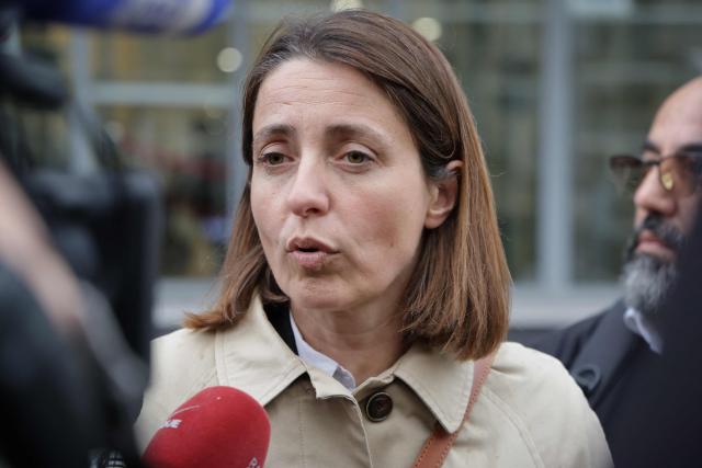 French trade union General Confederation of Labour (CGT) secretary general Sophie Binet and addresses the media as she arrives for a meeting with France's Labour Minister Jean-Pierre Farandou to discuss the proposed May 1st bill, in Paris on April 13, 2026. (Photo by Ludovic MARIN / AFP)