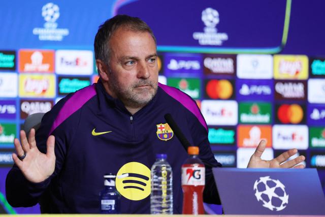 Barcelona's German coach Hans-Dieter Flick gestures as he gives a press conference on the eve of their UEFA Champions League quarter final second leg football match against Club Atletico de Madrid at Metropolitano Stadium in Madrid, on April 13, 2026. (Photo by Thomas COEX / AFP)