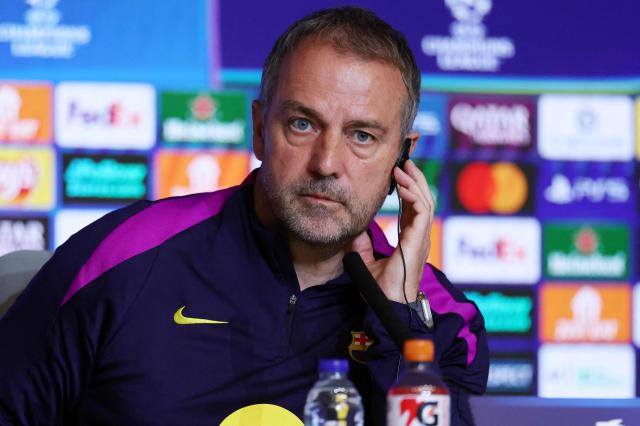 Barcelona's German coach Hans-Dieter Flick gives a press conference on the eve of their UEFA Champions League quarter final second leg football match against Club Atletico de Madrid at Metropolitano Stadium in Madrid, on April 13, 2026. (Photo by Thomas COEX / AFP)