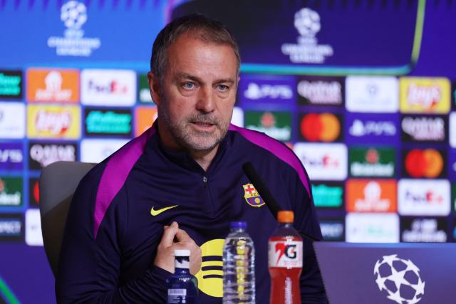 Barcelona's German coach Hans-Dieter Flick gestures as he gives a press conference on the eve of their UEFA Champions League quarter final second leg football match against Club Atletico de Madrid at Metropolitano Stadium in Madrid, on April 13, 2026. (Photo by Thomas COEX / AFP)