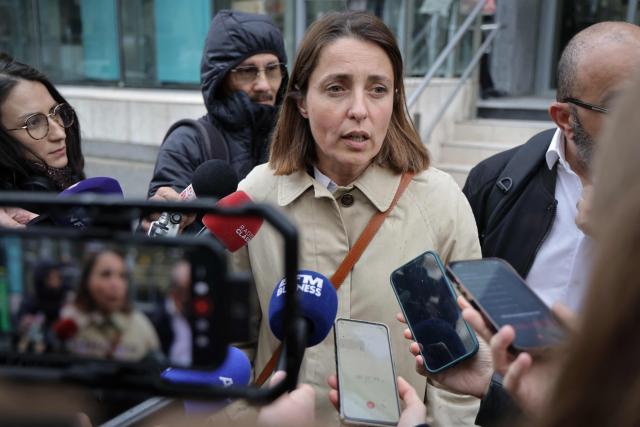 French trade union General Confederation of Labour (CGT) secretary general Sophie Binet (C) addresses the media as she arrives for a meeting with France's Labour Minister Jean-Pierre Farandou (not pictured) to discuss the proposed May 1st bill, in Paris on April 13, 2026. (Photo by Ludovic MARIN / AFP)