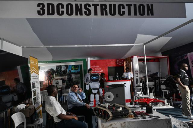 A general view of exhibitors during the 2nd edition of the International Exhibition on Artificial Intelligence, Defence and Space in Abidjan on April 13, 2026. (Photo by Issouf SANOGO / AFP)