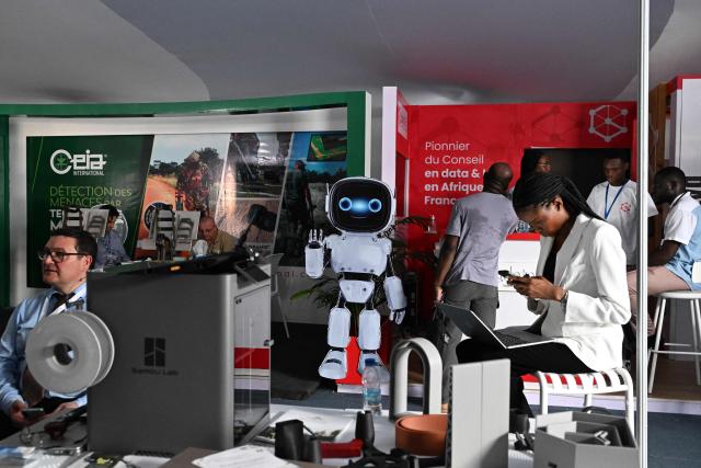 A general view of exhibitors during the 2nd edition of the International Exhibition on Artificial Intelligence, Defence and Space in Abidjan on April 13, 2026. (Photo by Issouf SANOGO / AFP)