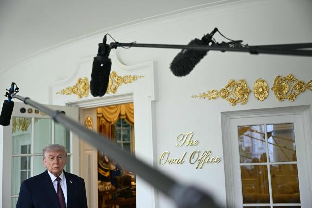 US President Donald Trump speaks to reporters outside the Oval Office at the White House, in Washington, DC, April 13, 2026. (Photo by Brendan SMIALOWSKI / AFP)