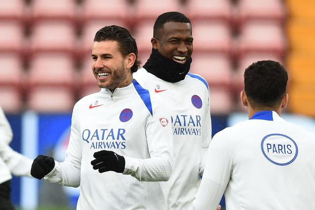 Paris Saint-Germain's French defender #21 Lucas Hernandez (L) and Paris Saint-Germain's Ecuadoran defender #51 Willian Pacho share a joke during a team training session at Anfield stadium in Liverpool, north-west England on April 13, 2026, on the eve of their UEFA Champions League, quarter final second leg football match against Liverpool. (Photo by PETER POWELL / AFP)