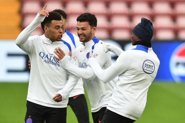 Paris Saint-Germain's French midfielder #14 Desire Doue (L) and Paris Saint-Germain's Portuguese forward #09 Goncalo Ramos (C) take part in a team training session at Anfield stadium in Liverpool, north-west England on April 13, 2026, on the eve of their UEFA Champions League, quarter final second leg football match against Liverpool. (Photo by PETER POWELL / AFP)