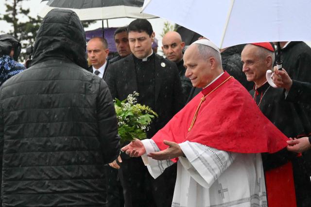 Pope Leo XIV leaves the Basilica of Our Lady of Africa after a meeting with the Algerian Community, in Algiers on April 13, 2026. Pope Leo XIV embarks today on an 11-day visit to Algeria, Cameroon, Angola and Equatorial Guinea for his first major international trip since becoming pontiff last year. (Photo by Alberto PIZZOLI / AFP)
