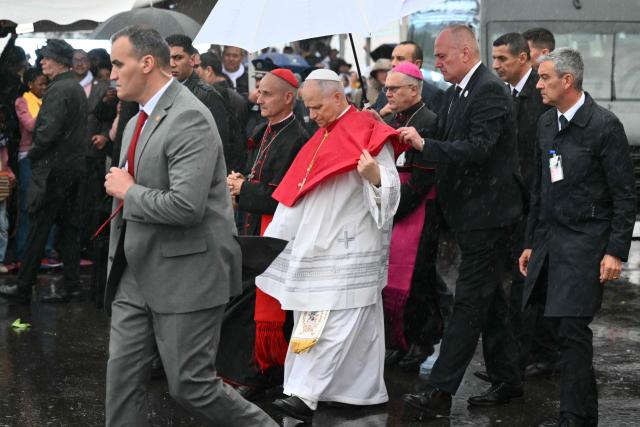 Pope Leo XIV leaves the Basilica of Our Lady of Africa after a meeting with the Algerian Community, in Algiers on April 13, 2026. Pope Leo XIV embarks today on an 11-day visit to Algeria, Cameroon, Angola and Equatorial Guinea for his first major international trip since becoming pontiff last year. (Photo by Alberto PIZZOLI / AFP)