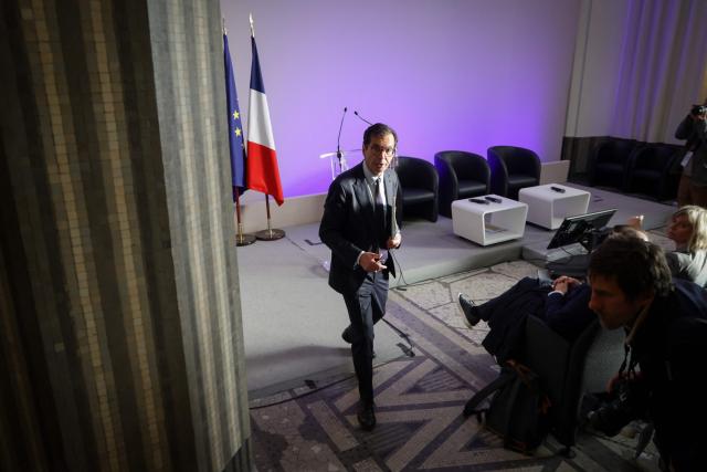 France's Labour Minister Jean-Pierre Farandou leaves after giving a press conference following a meeting between with unions to discuss the proposed May 1st bill, in Paris on April 13, 2026. (Photo by Ludovic MARIN / AFP)