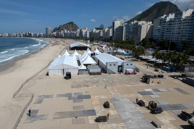 This aerial view shows the setting up of the stage for Colombian singer Shakira's concert at Copacabana Beach in Rio de Janeiro, Brazil on April 13, 2026. Brazilian police removed on April 13, 2026 an explosive device found on the promenade at Copacabana Beach in Rio de Janeiro, where Colombian singer Shakira is due to give a free mega-concert on May 2, authorities said. (Photo by Pablo PORCIUNCULA / AFP)