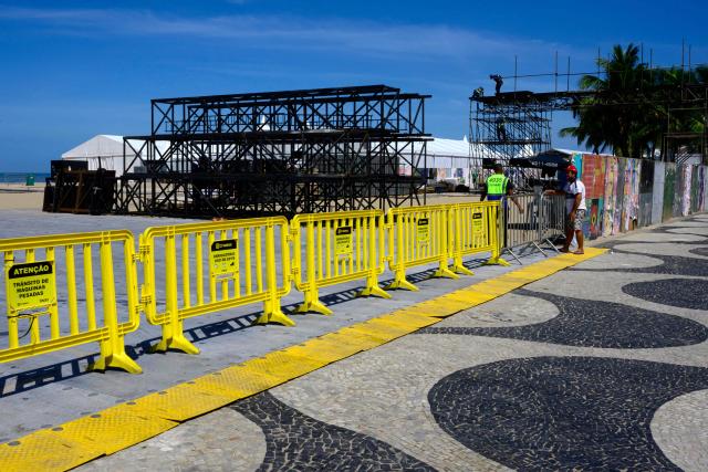 Workers set up the stage for Colombian singer Shakira's concert at Copacabana Beach in Rio de Janeiro, Brazil on April 13, 2026. Brazilian police removed on April 13, 2026 an explosive device found on the promenade at Copacabana Beach in Rio de Janeiro, where Colombian singer Shakira is due to give a free mega-concert on May 2, authorities said. (Photo by Pablo PORCIUNCULA / AFP)