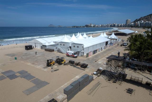 This aerial view shows the setting up of the stage for Colombian singer Shakira's concert at Copacabana Beach in Rio de Janeiro, Brazil on April 13, 2026. Brazilian police removed on April 13, 2026 an explosive device found on the promenade at Copacabana Beach in Rio de Janeiro, where Colombian singer Shakira is due to give a free mega-concert on May 2, authorities said. (Photo by Pablo PORCIUNCULA / AFP)