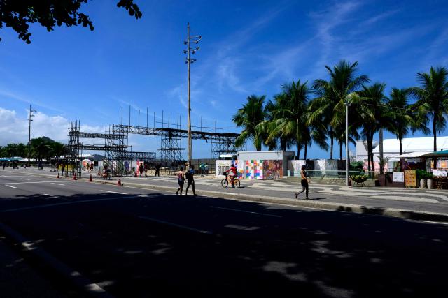 Workers set up the stage for Colombian singer Shakira's concert at Copacabana Beach in Rio de Janeiro, Brazil on April 13, 2026. Brazilian police removed on April 13, 2026 an explosive device found on the promenade at Copacabana Beach in Rio de Janeiro, where Colombian singer Shakira is due to give a free mega-concert on May 2, authorities said. (Photo by Pablo PORCIUNCULA / AFP)