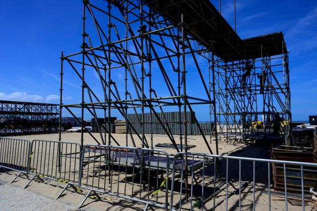 Workers set up the stage for Colombian singer Shakira's concert at Copacabana Beach in Rio de Janeiro, Brazil on April 13, 2026. Brazilian police removed on April 13, 2026 an explosive device found on the promenade at Copacabana Beach in Rio de Janeiro, where Colombian singer Shakira is due to give a free mega-concert on May 2, authorities said. (Photo by Pablo PORCIUNCULA / AFP)