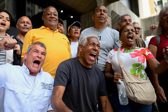Union members shout slogans as they protest against the police crackdown and for political freedoms outside the Ombudsman's Office in Caracas on April 13, 2026. (Photo by Federico PARRA / AFP)
