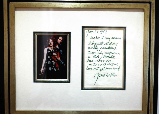 Jim Morrison’s handwritten will, ca. 1969 on display during a media preview at Sotheby’s Rock & Pop auction on April 13, 2026 in New York City, dedicated to objects and moments that have shaped classic rock and contemporary pop. The guitars are part of Sotheby's "Rock & Pop" sale taking place in April. (Photo by TIMOTHY A. CLARY / AFP)