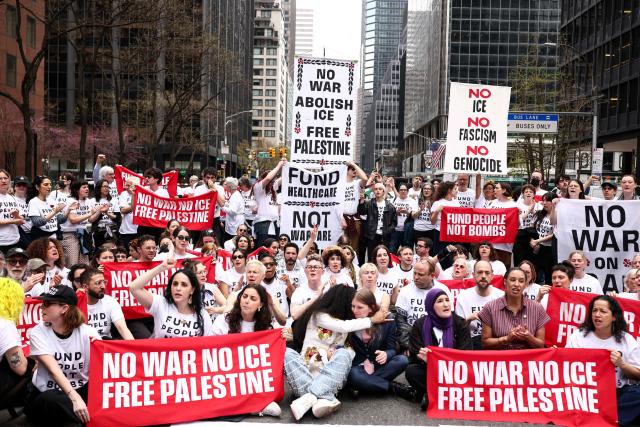 Protesters take part in a sit-in on Third Avenue in New York City on April 13, 2025. People gathered in front of the office of US Senate Minority Leader Chuck Schumer's office to protest against the war in Iran, Immigration and Customs Enforcement (ICE) and in support of Palestinians. (Photo by CHARLY TRIBALLEAU / AFP)
