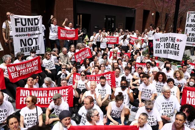 Protesters take part in a sit-in on Third Avenue in New York City on April 13, 2025. People gathered in front of the office of US Senate Minority Leader Chuck Schumer's office to protest against the war in Iran, Immigration and Customs Enforcement (ICE) and in support of Palestinians. (Photo by CHARLY TRIBALLEAU / AFP)
