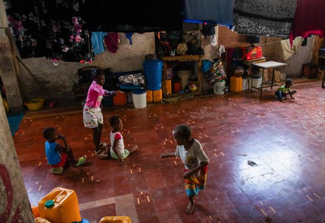 Children play in a shelter for displaced people at the Rex Theatre in downtown Port-au-Prince, Haiti, on April 13, 2026. (Photo by Clarens SIFFROY / AFP)