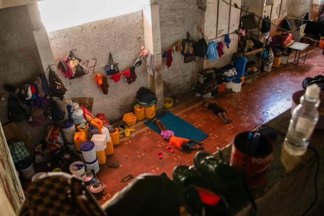 Children rest in a shelter for displaced people at the Rex Theatre in downtown Port-au-Prince, Haiti, on April 13, 2026. (Photo by Clarens SIFFROY / AFP)