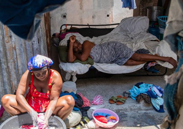 Women are seen at a shelter for displaced people at the Rex Theatre in downtown Port-au-Prince, Haiti, on April 13, 2026. (Photo by Clarens SIFFROY / AFP)