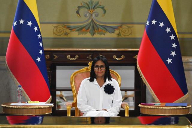 Venezuela's interim President Delcy Rodriguez looks on during a signing of an agreement ceremony between Chevron Venezuela and the national government at the Miraflores Palace in Caracas on April 13, 2026. (Photo by Juan BARRETO / AFP)