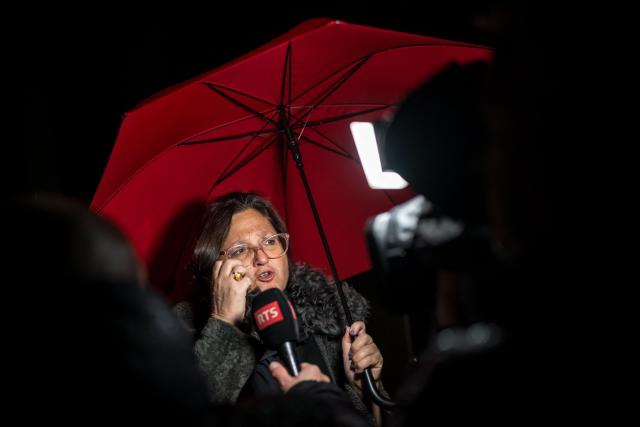 Bar owners Jacques and Jessica Moretti's lawyer Yael Hayat speaks at the end of the hearing of the Mayor of Crans-Montana, as part of the investigation over the fire that broke out in the bar "Le Constellation" during New Year celebrations, claiming 41 lives, most of them teenagers, and injuring 115 others, in Sion, western Switzerland, on April 13, 2026. (Photo by Fabrice COFFRINI / AFP)