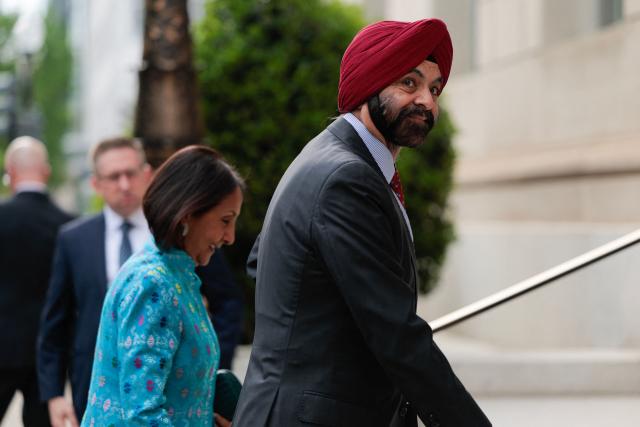 World Bank Group President Ajay Banga and his wife Ritu Banga arrive for an event in honor of Dutch King Willem-Alexander (L) and Queen Maxima at the US Chamber of Commerce in Washington, DC, on April 13, 2026. (Photo by Kent Nishimura / AFP)