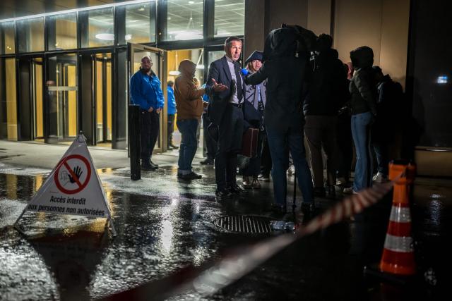 One of the plaintiff's lawyer Alain Viscolo (C) speaks at the end of the hearing of the Mayor of Crans-Montana, as part of the investigation over the fire that broke out in the bar "Le Constellation" during New Year celebrations, claiming 41 lives, most of them teenagers, and injuring 115 others, in Sion, western Switzerland, on April 13, 2026. (Photo by Fabrice COFFRINI / AFP)
