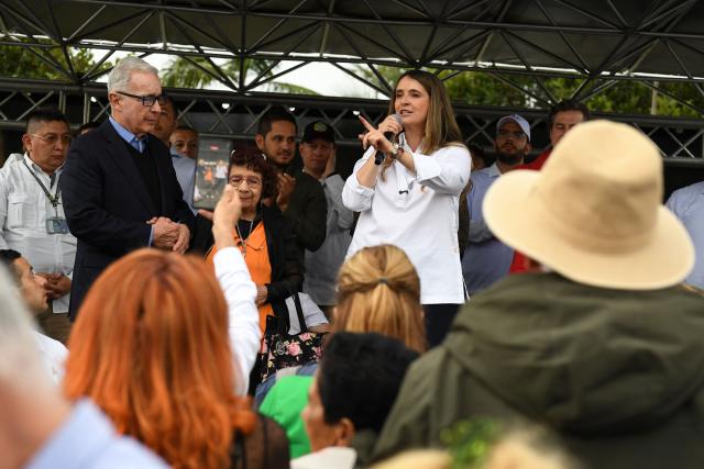 Colombia's presidential candidate Paloma Valencia, of the Centro Democratico party, speaks during a campaign rally accompanied by Colombia's former President (2002-2010) Alvaro Uribe (L) in Rionegro, Antioquia department, Colombia, on April 13, 2026. The Colombian government reinforced security for opposition presidential candidate Paloma Valencia after she reported receiving death threats less than two months before the election. Colombia will hold presidential elections on May 31. (Photo by Jaime SALDARRIAGA / AFP)