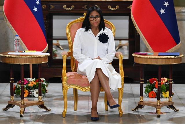 Venezuela's interim President Delcy Rodriguez looks on during a signing of an agreement ceremony between Chevron Venezuela and the national government at the Miraflores Palace in Caracas on April 13, 2026. Venezuela’s interim president, Delcy Rodriguez, praised on April 13 the progress made in the oil sector regarding foreign investment as part of the signing of agreements with the U.S. giant Chevron to increase crude oil production. (Photo by Juan BARRETO / AFP)