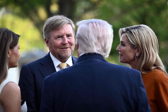 King of the Netherlands Willem-Alexander (C-L) and Queen Maxima (R) are welcomed by US President Donald Trump and First Lady Melania Trump into the White House in Washington, DC, on April 13, 2026. (Photo by Brendan SMIALOWSKI / AFP)