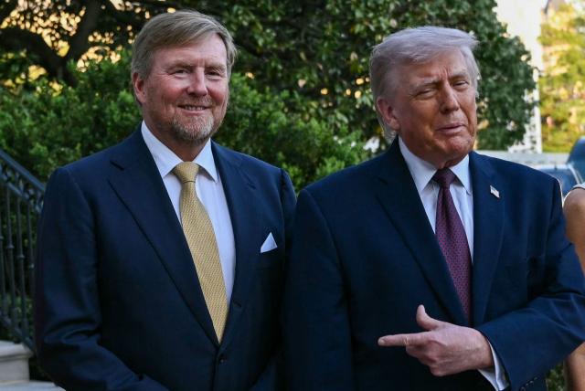 King of the Netherlands Willem-Alexander (L) is welcomed by US President Donald Trump  into the White House in Washington, DC, on April 13, 2026. (Photo by Brendan SMIALOWSKI / AFP)