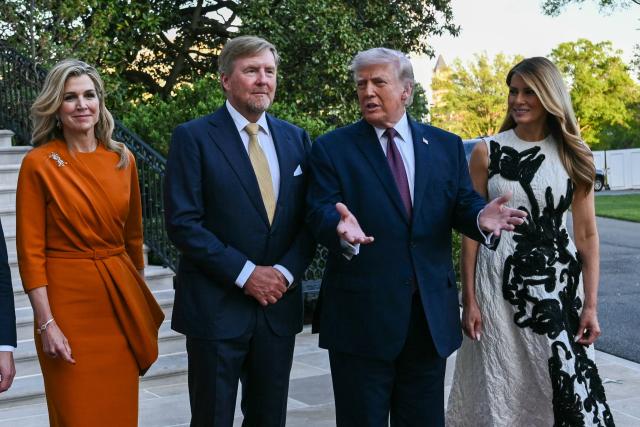 King of the Netherlands Willem-Alexander (C-L) and Queen Maxima (L) are welcomed by US President Donald Trump and First Lady Melania Trump into the White House in Washington, DC, on April 13, 2026. (Photo by Brendan SMIALOWSKI / AFP)