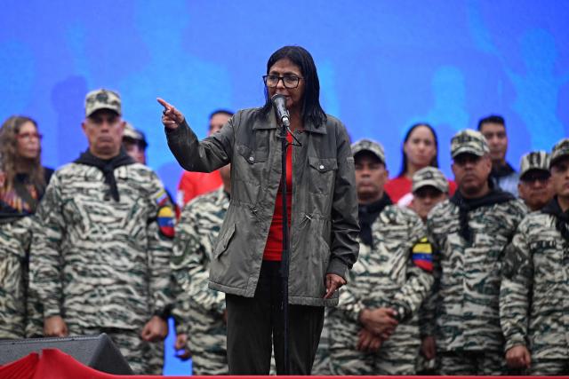Venezuela's interim President Delcy Rodriguez delivers a speech during a civil-military parade marking the 24th anniversary of late Venezuelan president Hugo Chavez's (1999-2013) return to power after a failed 2002 coup, in Caracas on April 13, 2026. (Photo by Federico PARRA / AFP)