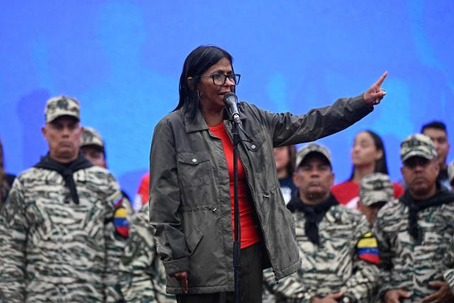 Venezuela's interim President Delcy Rodriguez delivers a speech during a civil-military parade marking the 24th anniversary of late Venezuelan president Hugo Chavez's (1999-2013) return to power after a failed 2002 coup, in Caracas on April 13, 2026. (Photo by Federico PARRA / AFP)