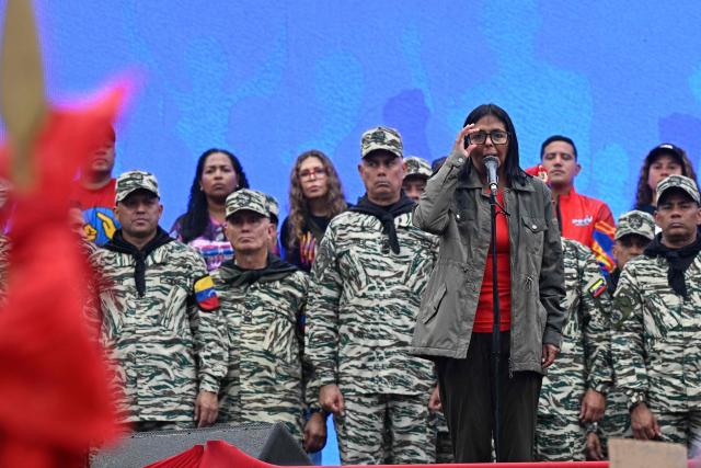 Venezuela's interim President Delcy Rodriguez delivers a speech during a civil-military parade marking the 24th anniversary of late Venezuelan president Hugo Chavez's (1999-2013) return to power after a failed 2002 coup, in Caracas on April 13, 2026. (Photo by Federico PARRA / AFP)