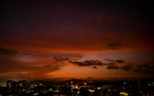 This view shows the Panama City during sunset on April 13, 2026. (Photo by MARTIN BERNETTI / AFP)
