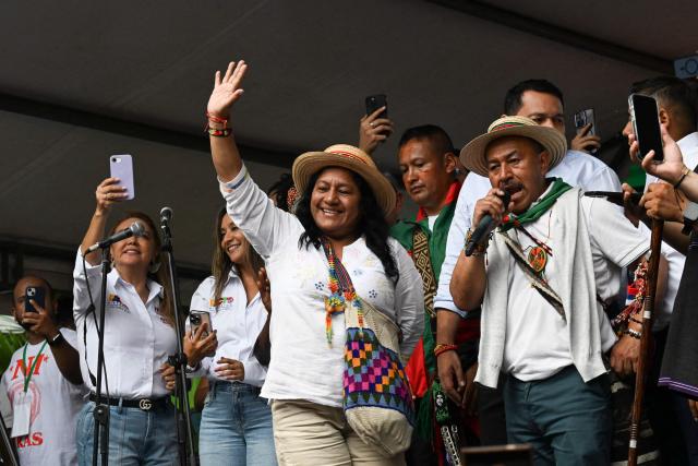 Colombia's vice-presidential candidate Aida Quilcue (C), for the Pacto Historico party, waves to supporters during a campaign rally in Cali, Valle del Cauca department, Colombia on April 13, 2026. Colombia will hold presidential elections on May 31. (Photo by JOAQUIN SARMIENTO / AFP)