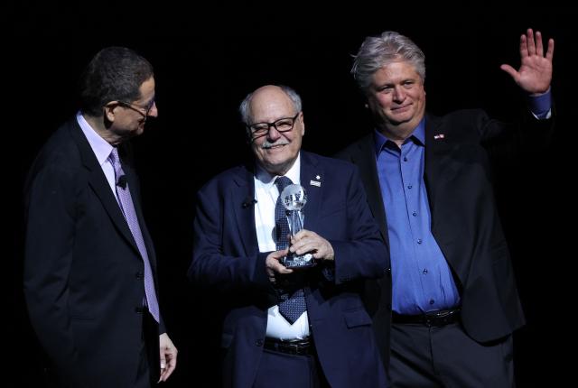 (L-R) Tom Rothman, Chairman & CEO, Sony Pictures' Motion Picture Group, Ellis Jacob, President and CEO of Cineplex and Michael O’Leary, President & CEO, Cinema United, stand onstage during the Sony Pictures Entertainment Presentation & Opening Night at CinemaCon at The Colosseum at Caesars Palace on April 13, 2026 in Las Vegas, Nevada. (Photo by VALERIE MACON / AFP)